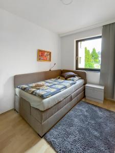 A bed or beds in a room at Máté Pension