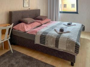A bed or beds in a room at Máté Pension