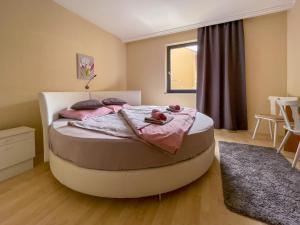A bed or beds in a room at Máté Pension