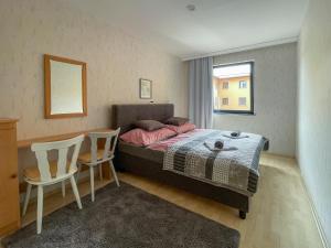 A bed or beds in a room at Máté Pension