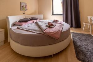 A bed or beds in a room at Máté Pension
