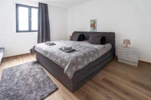 A bed or beds in a room at Máté Pension