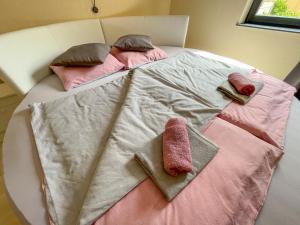 A bed or beds in a room at Máté Pension