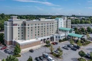 an aerial view of a hotel with a parking lot at Embassy Suites Atlanta - Kennesaw Town Center in Kennesaw