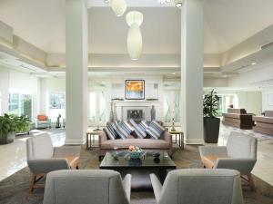 a living room with a couch and chairs and a fireplace at Hilton Garden Inn Atlanta NW/Kennesaw-Town Center in Kennesaw