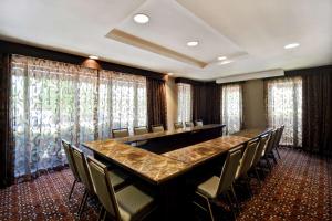 a conference room with a long table and chairs at Hampton Inn Atlanta-Mall Of Georgia in Buford +36 photos