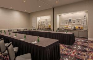 a conference room with rows of tables and chairs at DoubleTree by Hilton Austin in Austin