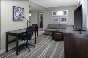 a living room with a desk and a computer in a room at Homewood Suites by Hilton Columbia in Columbia
