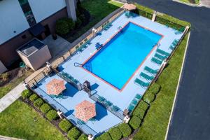 an overhead view of a swimming pool with chaise lounge chairs at Hampton Inn Batesville in Batesville