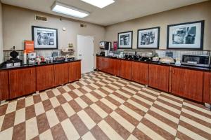 a restaurant with a food counter in a room at Hampton Inn Batesville in Batesville