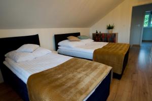 מיטה או מיטות בחדר ב-Domek Zacisze