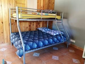 a couple of bunk beds in a room at LE MACADAMIA in Cilaos