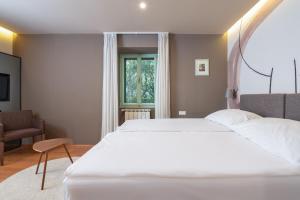 Postel nebo postele na pokoji v ubytování Hotel Nostromo