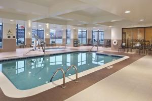 a large swimming pool in a hotel room at Hilton Garden Inn Akron in Akron