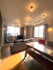 a living room with a couch and a table at YUZUKI - Vacation STAY 93012v in Takamatsu