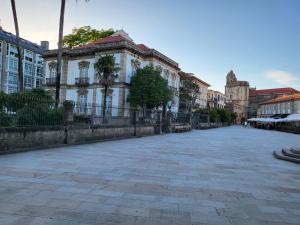 an empty street in a city with buildings at CASA MARUXA pensión in Pontevedra