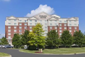 a large building with a sign on the front of it at Embassy Suites by Hilton Cleveland Rockside in Independence