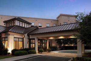 uma representação de um edifício com telhado de metal em Hilton Garden Inn Charlotte/Ayrsley em Charlotte