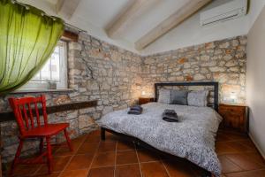 Postel nebo postele na pokoji v ubytování Casa Nini I - Jacuzzi