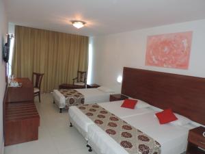 Postel nebo postele na pokoji v ubytování Corfu Hotel