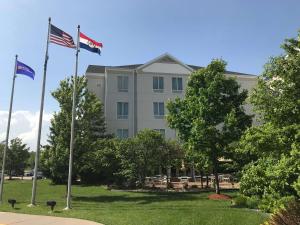 a building with two flags in front of it at Hilton Garden Inn Columbia in Columbia
