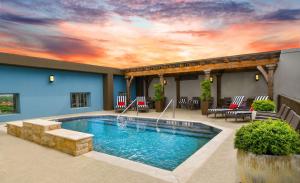 a pool with a sky painted on the wall at Hilton Dallas-Park Cities in Dallas