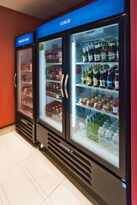 a refrigerator with its door open with food and drinks at Hilton Garden Inn Dayton South - Austin Landing in Springboro