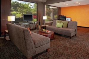 a living room with two chairs and a couch at DoubleTree Suites by Hilton Dayton/Miamisburg in Miamisburg