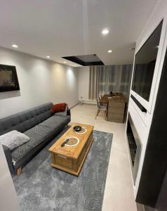 a living room with a couch and a table at Zara at Saint Raphael France in Saint-Raphaël