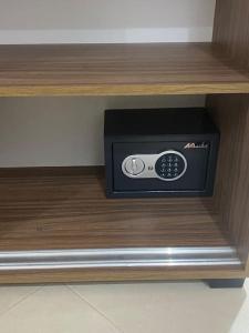a microwave sitting on a shelf in a drawer at Appartement Anir in Agadir