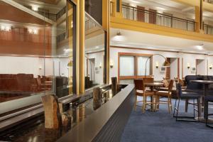 a dining room with a table and chairs at Embassy Suites by Hilton Denver International Airport in Denver