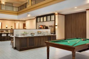 a pool table in the middle of a room at Embassy Suites by Hilton Denver International Airport in Denver