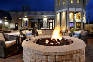 a fire pit in the middle of a patio at DoubleTree by Hilton Hotel Denver - Thornton in Thornton