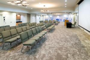 a room with a row of chairs and a podium at Hilton Garden Inn Denton in Denton +41 photos