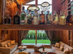 a room with a shelf filled with bottles of alcohol at Firnelicht in Gressoney-Saint-Jean