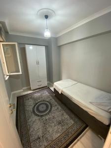 Postel nebo postele na pokoji v ubytování YZC APART