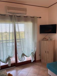 TV a/nebo společenská místnost v ubytování Veliero House