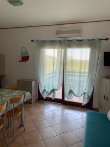 TV a/nebo společenská místnost v ubytování Veliero House