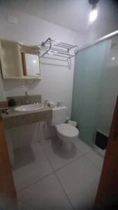 a bathroom with a toilet and a sink and a mirror at ISRAEL FLAT TAMBAÚ - 102 in João Pessoa +3 photos