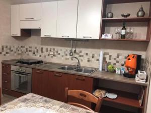 Kuchyň nebo kuchyňský kout v ubytování B&B Cardone