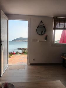 a living room with a view of the ocean at Casiña Palmira in Finisterre