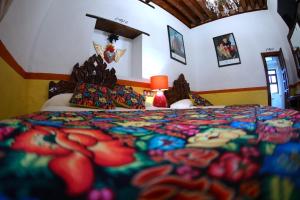 Postel nebo postele na pokoji v ubytování HOTEL CASA BAEZ