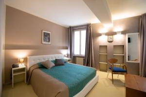 Postel nebo postele na pokoji v ubytování Alessi Hotel Trattoria