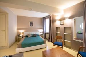 Postel nebo postele na pokoji v ubytování Alessi Hotel Trattoria