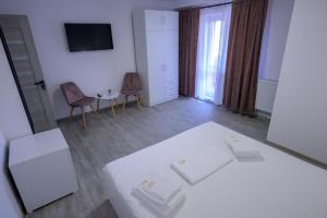 Postel nebo postele na pokoji v ubytování Vila RD