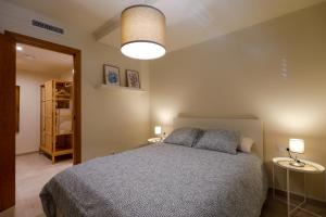 A bed or beds in a room at Mediterranean City