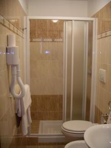 a bathroom with a shower and a toilet and a sink at Appartamento Privato Simone in Rome