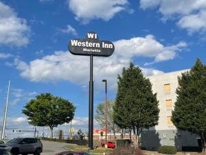 a sign for a westwegian inn in front of a building at Western Inn Marietta in Atlanta