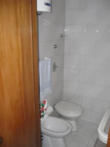 a bathroom with a toilet and a sink at Near the Duomo in Erice