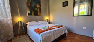Postel nebo postele na pokoji v ubytování Apartment Bosiljak